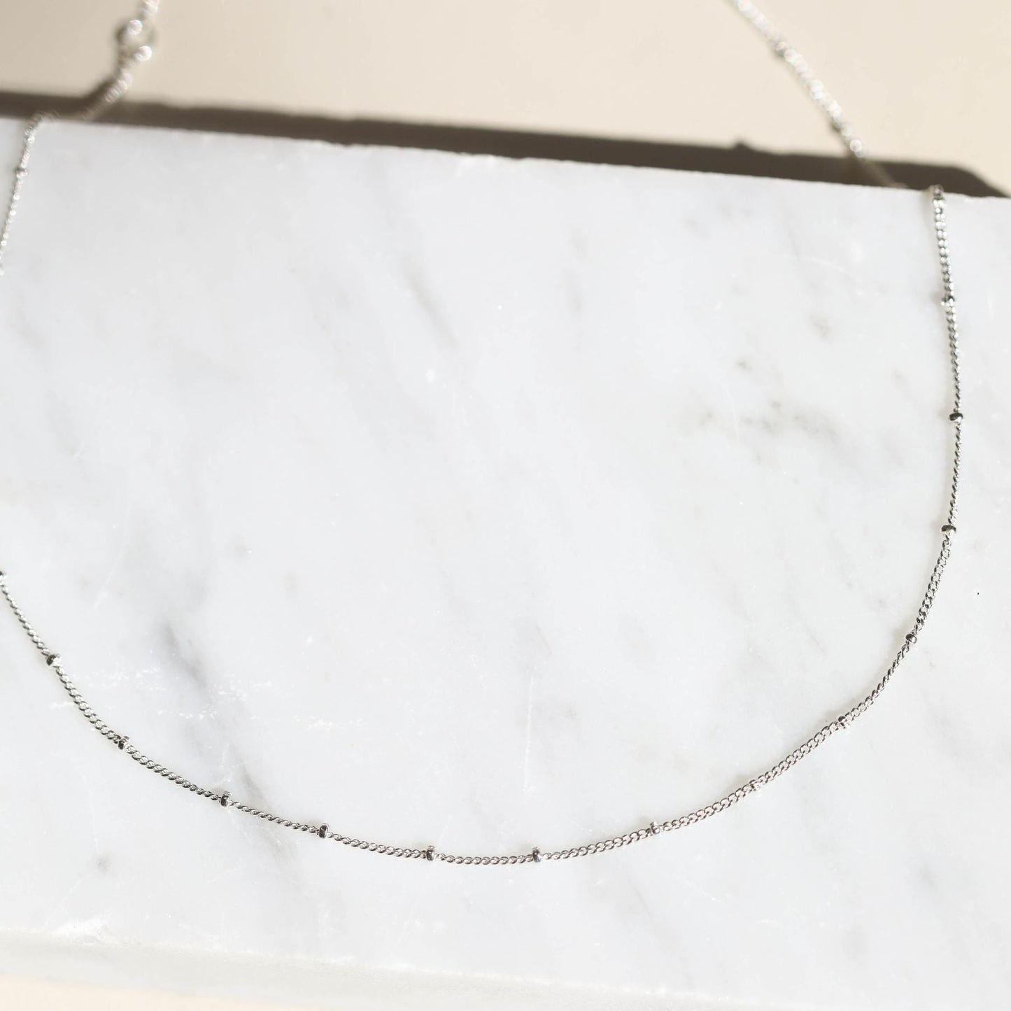 Delicate Silver Saturn Chain Necklace Design