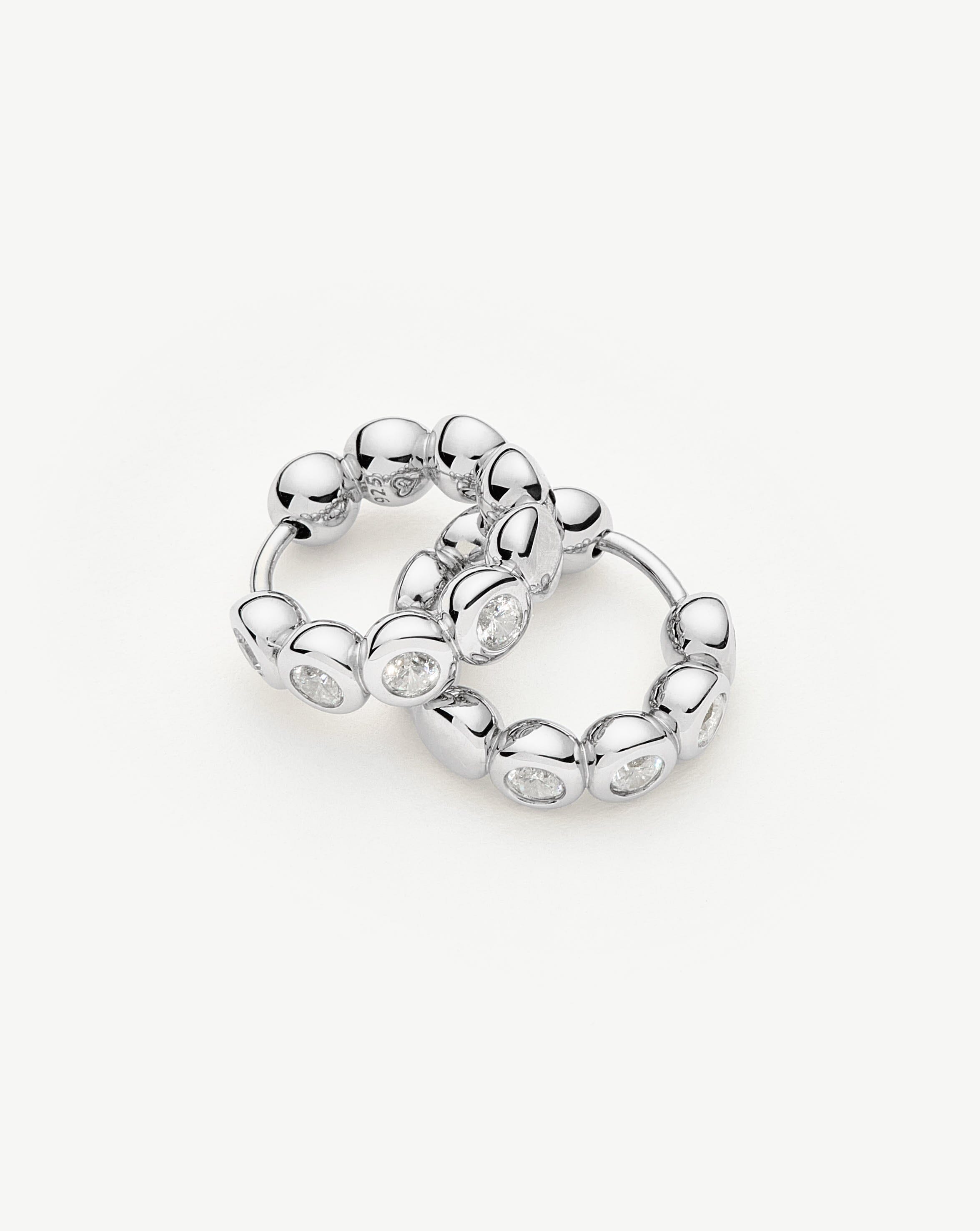 tennis-small-hoop-earrings-sterling-silver-cubic-zirconia-earrings-missoma-931096_b7022a0b-69ca-4349-abd9-88db9c04e3ca.jpg