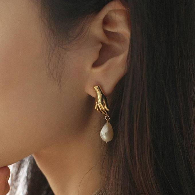 Gold Earrings with Finger Pearl Design